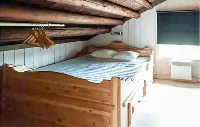 a bunk bed in a room with a window at 2 Bedroom Gorgeous Home In Eggedal in Eggedal