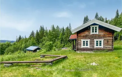 a small wooden house in a field with trees at 2 Bedroom Gorgeous Home In Eggedal in Eggedal