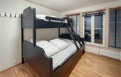 a bedroom with a bunk bed and a window at Awesome Apartment In Tyinkrysset in Tyinkrysset