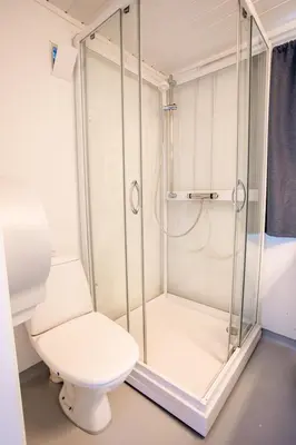 a bathroom with a shower and a toilet at Koie Family in Stranda