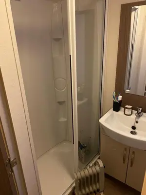 a bathroom with a shower and a sink at Koie Holiday Home 3 in Stranda