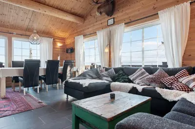 a living room with a couch and a table at Trysilfjellet in Trysil