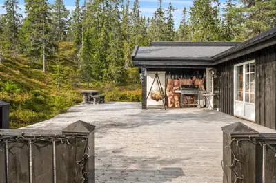 a house with a garage and a driveway at Trysilfjellet in Trysil