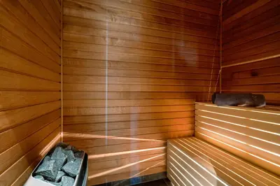 a sauna with wooden walls and a bench in it at Riddertunets top notch in Beitostøl