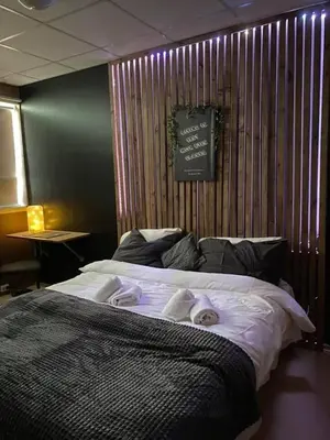 a bedroom with a bed with two towels on it at Gjøvik Overnatting in Gjøvik