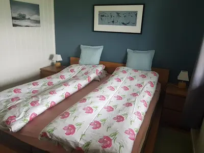 two beds sitting next to each other in a bedroom at Rekdal in Vestnes