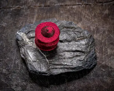 a rock with a red object on top of it at Skåbu Fjellhotell in Skåbu