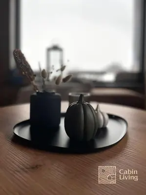 a plate with pumpkins and candles on a table at New ski in-out apartment with sauna in Hafjell in Øyer