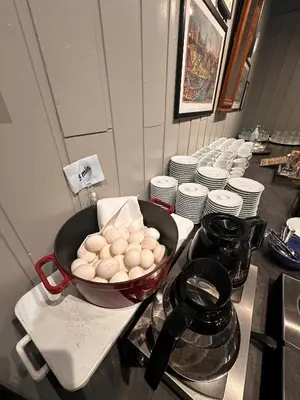 a kitchen counter with a bowl of eggs on a stove at Hofslund Apartments in Sogndal
