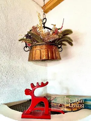 a light hanging from a wall with a christmas ornament at Cozy apartment with a view and ski inout Hafjell in Hafjell