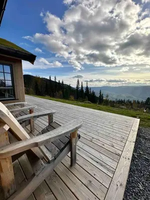 a wooden deck with a bench on top of a building at Aurdalsåsen panorama in Aurdal