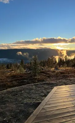 a wooden walkway with a view of a mountain at Aurdalsåsen panorama in Aurdal