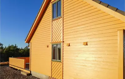 a side view of a wooden building with a window at 4 Bedroom Stunning Home In Auklandshamn in Tjernagel