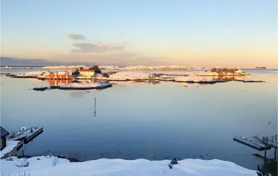 a large body of water with snow on it at Lovely Home In Smøla With Kitchen in Smøla
