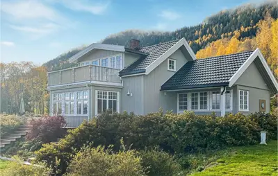 a house with a mountain in the background at Lovely Home In Bjoneroa With Wifi in Bjoneroa