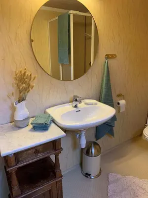 a bathroom with a sink and a mirror at Enok Hytter & Resort in Liagardane