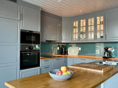 a kitchen with a bowl of fruit on a counter at 6 person holiday home in Huglo-By Traum in Nordhuglo