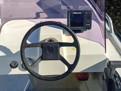 a steering wheel of a boat with a camera at 12 person holiday home in Selje-By Traum in Selje