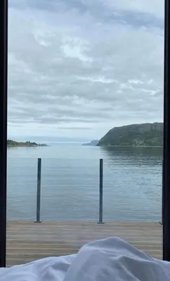 a view of the ocean from a bedroom window at Ocean View Stad in Barmen