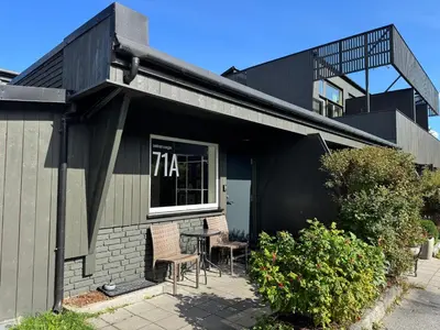 a house with two chairs and a table in the window at Sentrumsvegen - Private Studio Apartment in Gol in Gol