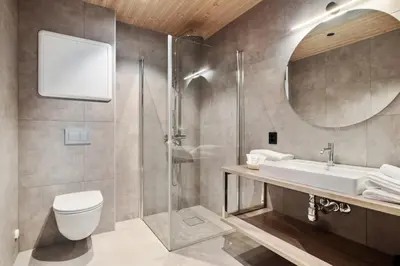 a bathroom with a sink toilet and a mirror at Wangen Apartments in Aurland