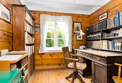 an office with a desk and a window at Alone In The Woods With Your Own River Nearby in Fitjar