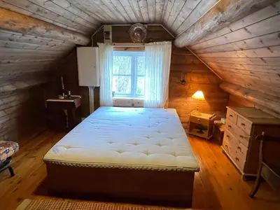 a bedroom with a large bed in a attic at 8 person holiday home in Åkra-By Traum in Åkra