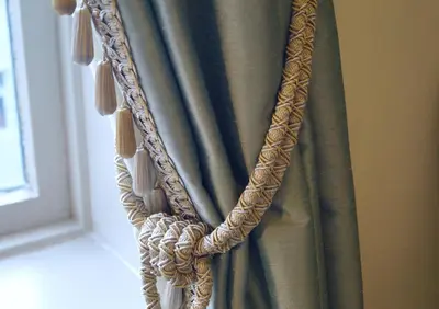 a curtain hanging in a room next to a window at Jugend 1905 in Ålesund