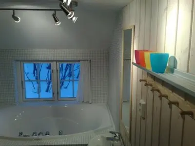 a bathroom with a bath tub and a window at Gålå Fjellhytter in Gålå