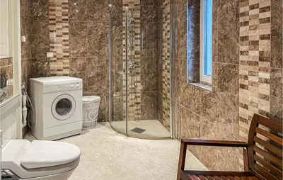 a bathroom with a shower and a washing machine at 1 Bedroom Nice Apartment In Hamar in Hamar