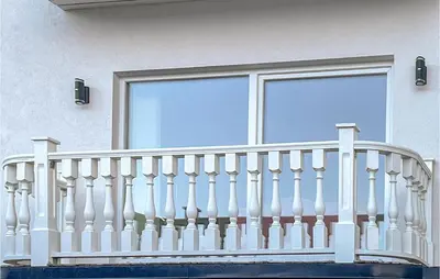a white fence in front of a window at 1 Bedroom Nice Apartment In Hamar in Hamar