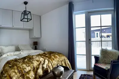 a bedroom with a bed and a large window at New apartment near the lifts tourist center Trysil in Trysil