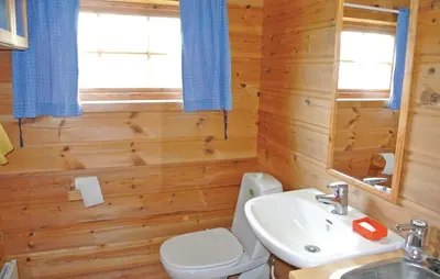 a bathroom with a toilet and a sink at Holiday Home Haugastøl Xxxix in Haugastøl