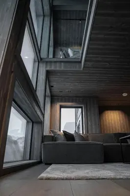 a living room with a couch and a window at The Panorama Retreat - Rindabotn Cabin in Sogndal