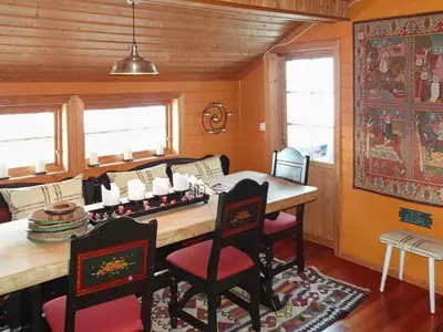 a dining room with a wooden table and chairs at 10 person holiday home in Svingvoll-By Traum in Svingvoll