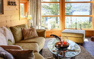 a living room with a couch and a table at Beautiful Home In Hebnes With Kitchen in Hebnes