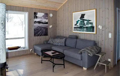 a living room with a couch and a window at Awesome Home In Rauland With Kitchen in Rauland