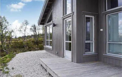 a porch of a house with a wooden door at Awesome Home In Rauland With Kitchen in Rauland