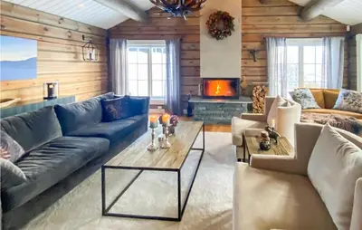 a living room with a couch and a table at Lovely Home In Rauland With Sauna in Rauland