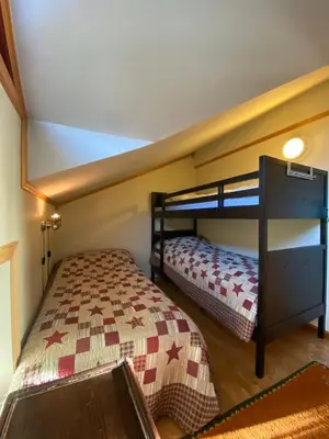 a bedroom with two bunk beds in a room at Apartment City Beitostølen in Beitostøl