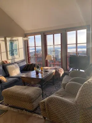 a living room with a couch and chairs and a table at Apartment City Beitostølen in Beitostøl