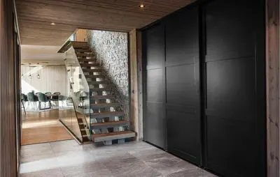 a staircase in a house with black walls at Stunning View In Holiday Home in Gol