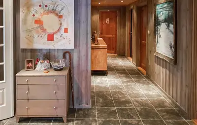 a hallway with a dresser and a tile floor at Cozy Home In Ulnes With Sauna in Ulnes