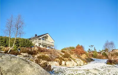 a house on the side of a hill at 4 Bedroom Cozy Home In Fitjar in Fitjar