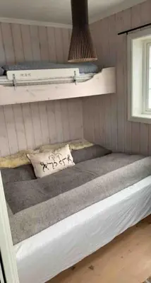 a bunk bed in a room with a window at Gaustablikk - ski in & out apartment - Mountain View in Gaustablikk
