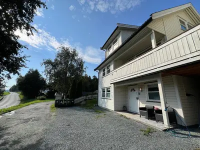 a house with a driveway in front of a house at Bratsberg Apartment - with Kitchenette and Free Parking in Trondheim