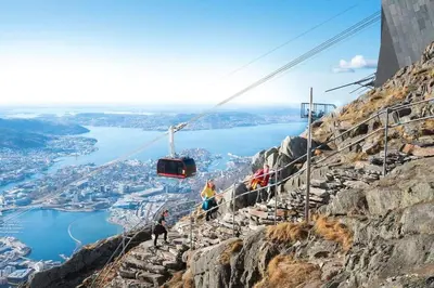 a cable car on the side of a mountain at Brand new and luxurious penthouse in Bergen city centre! in Bergen