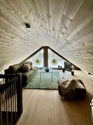 a living room with a large wooden ceiling at Brand new cabin at Hovden cross-country skiing in Hovden