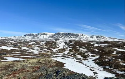a snowy mountain with snow covered mountains in the background at Awesome Home In Ustaoset With Wifi in Ustaoset