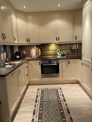 a kitchen with white cabinets and a kitchen rug at Geilo-Kikut, Ski-In, Ski-Out with Stunning Trails and Perfect Location in Geilo